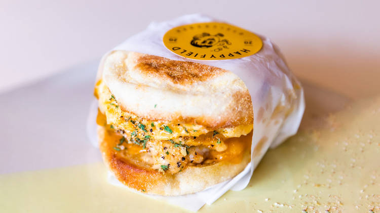 An egg muffin sandwich wrapped in paper