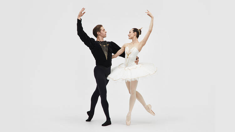 A man and a woman in a joined ballet pose