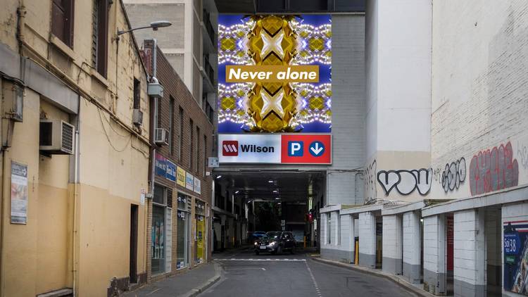 Artist render of a billboard with "Never Alone" on it about the Wilsons Carpark on Bourke St