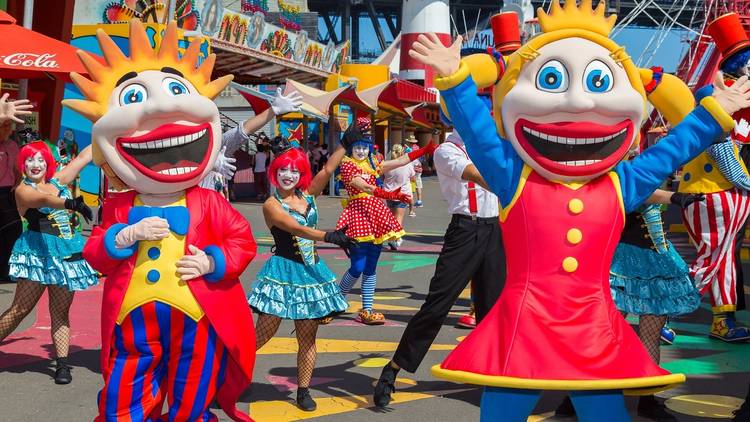 Performers in costume as the Luna Park clown