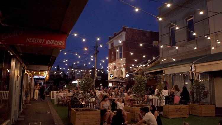 People dining outside at night