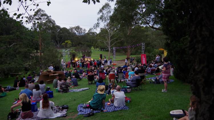 People sitting on the lawns at Heide Sculpture park