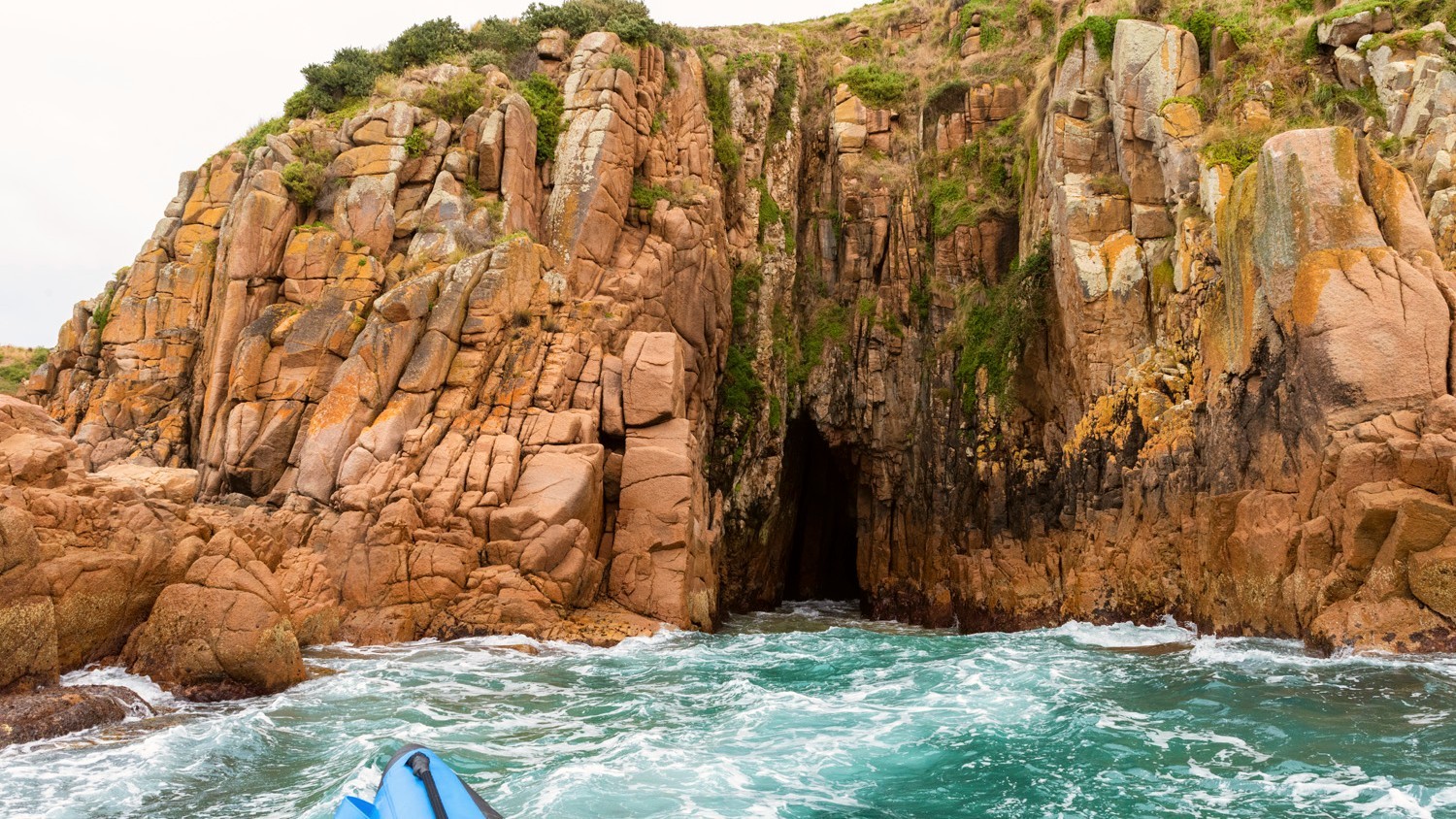 Sea caves seen from an Ocean Adventures boat