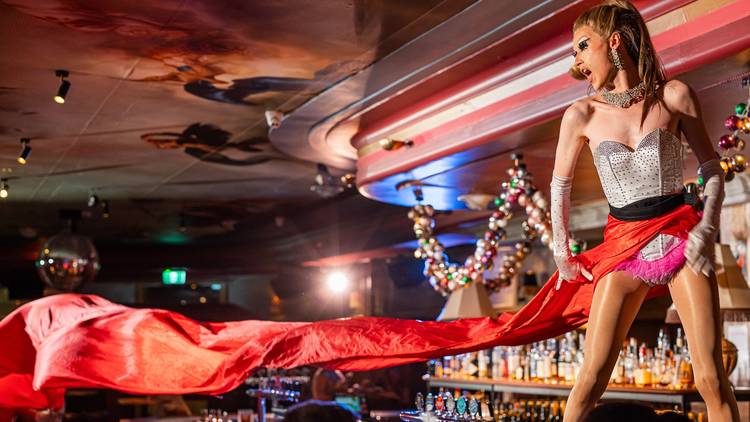 Drag queen dances on bar