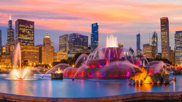 Chicago skyline panorama with skyscrapers and Buckingham fountain at twilight. Chicago skyline panorama with skyscrapers and Buckingham fountain at twilight.