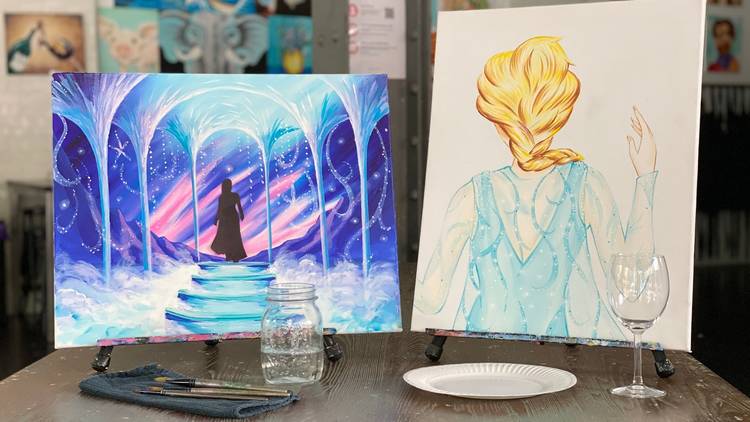 Two canvases with Frozen the Musical scenes painted