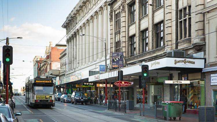 A tram travelling down chapel street in Prahran