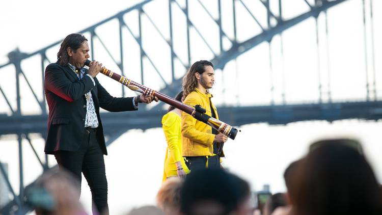 William Barton plays didgeridoo with Sydney Harbour Bridge in background