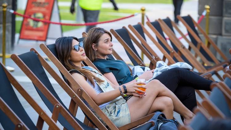 Two women in the audience of Pentridge Open Air Cinema