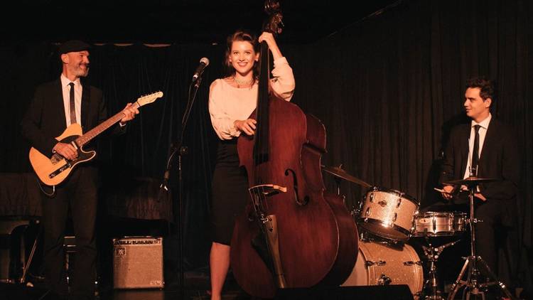 Mary Heart with playing double bass in her three-piece band