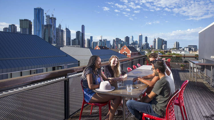 Group of friends enjoying the Melbourne Metro rooftop 