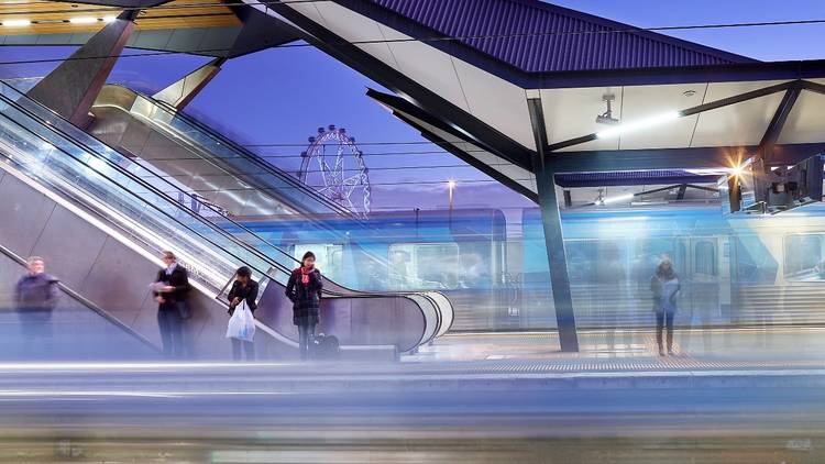 People waiting on a train platform in Melbourne