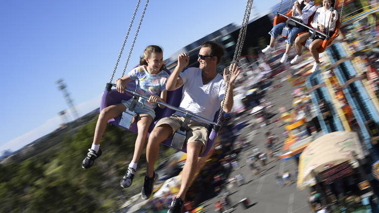 Adult and child ride on swinging chairs ride