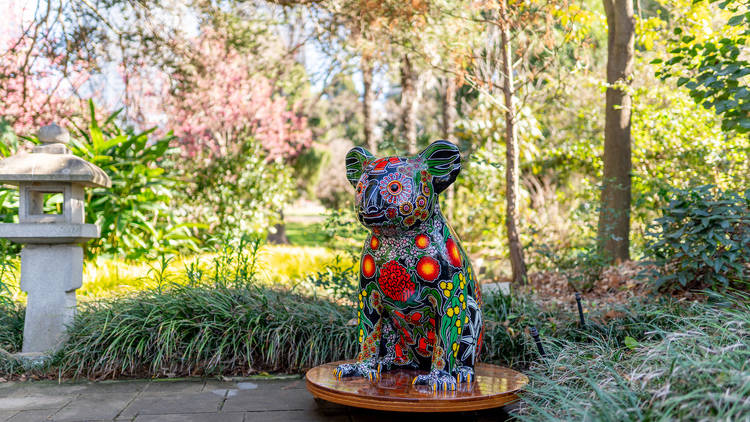 Sculpture of koala set again bushland