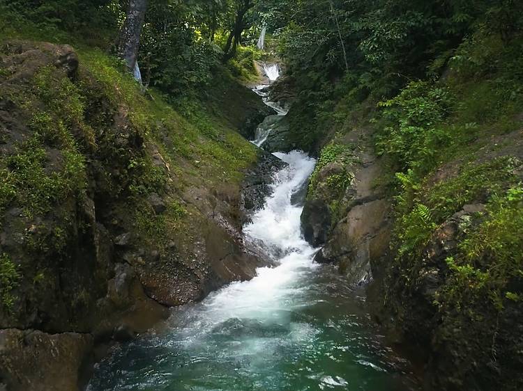 Slip down a natural rock waterslide