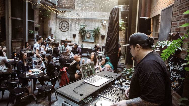 A DJ in a laneway