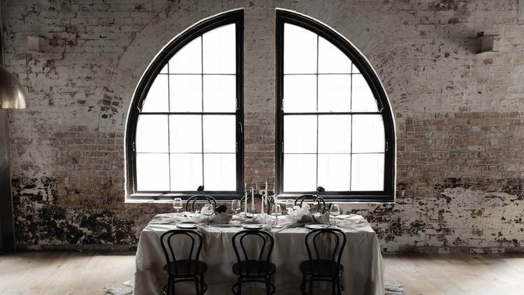 Table and chairs in front of window