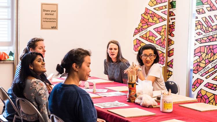 People sit at table doing workshop 