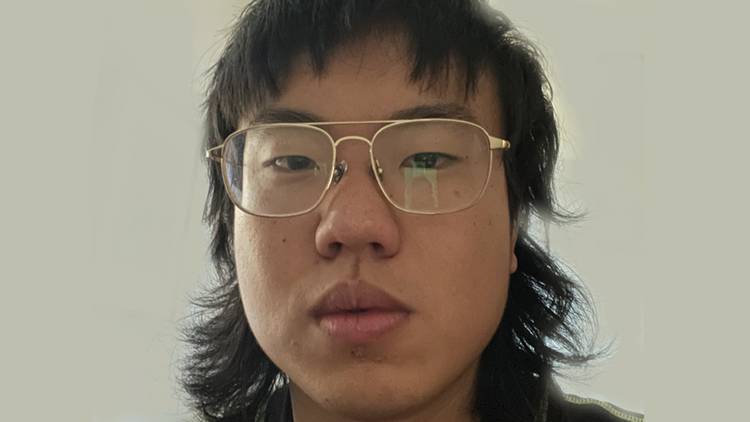 A close up of comedian Aaron Chen in glasses