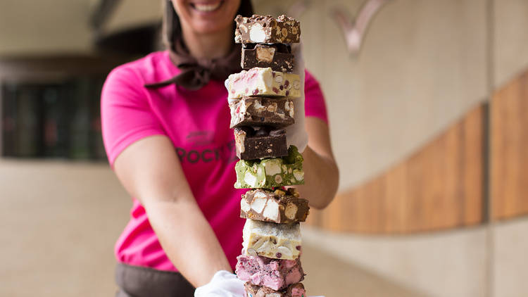 Stack of rocky road being held up