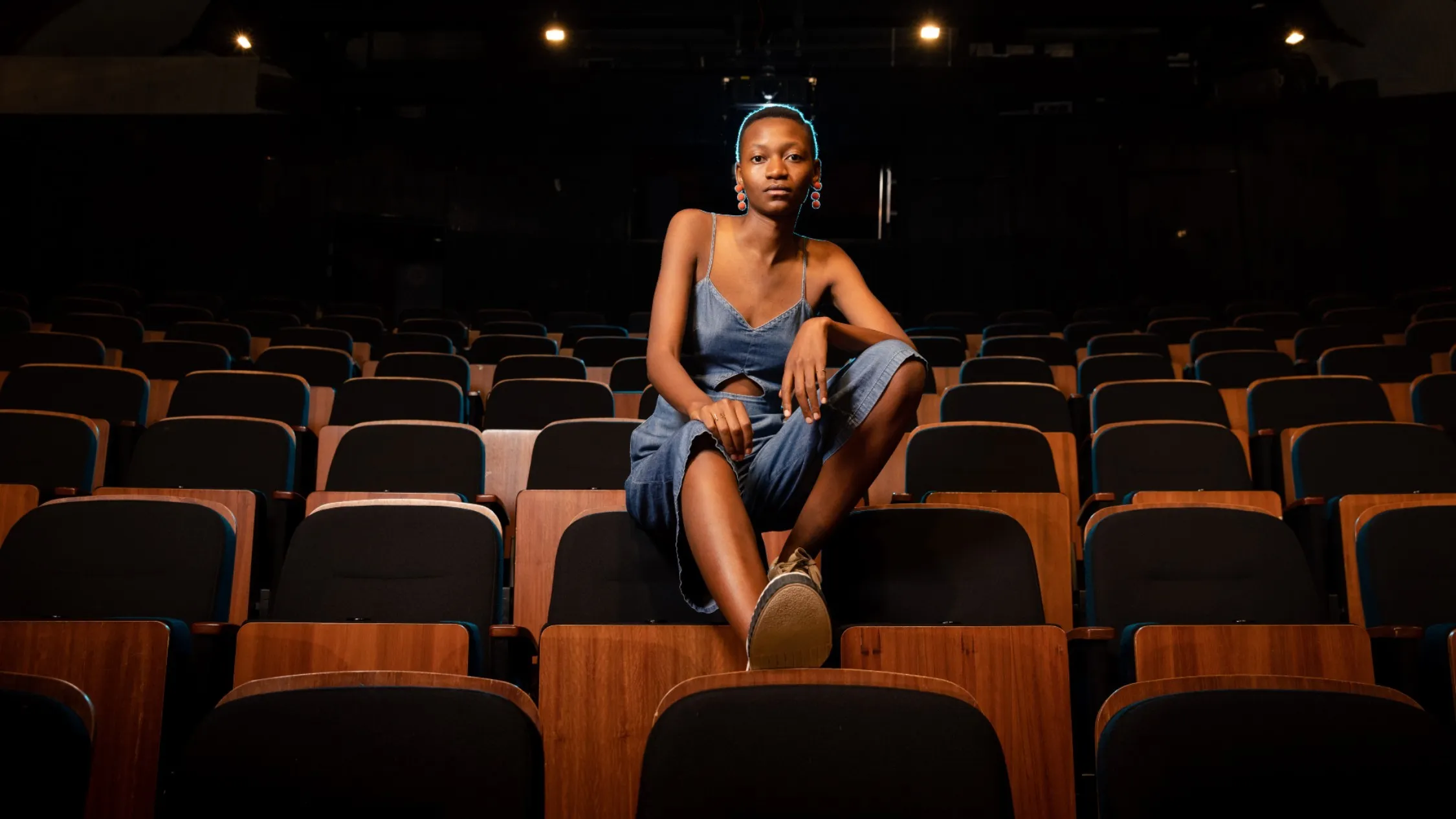 Moreblessing Maturure perched on top of theatre seats