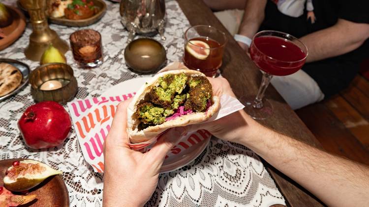 Person holding falafel