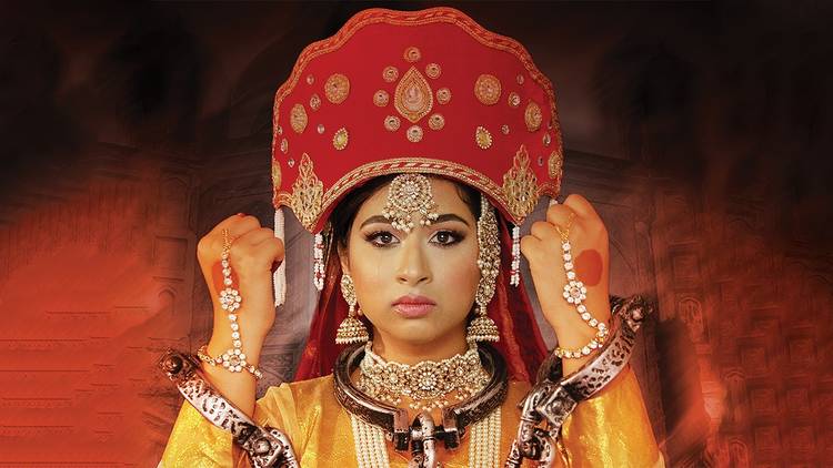 Woman in ornate headpiece 