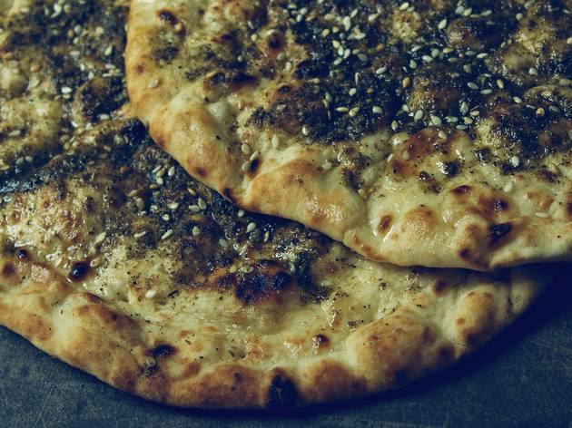 Zaatar bread Two pieces of Zaatar, a Middle Eastern flatbread topped with oregano and seasame seeds.