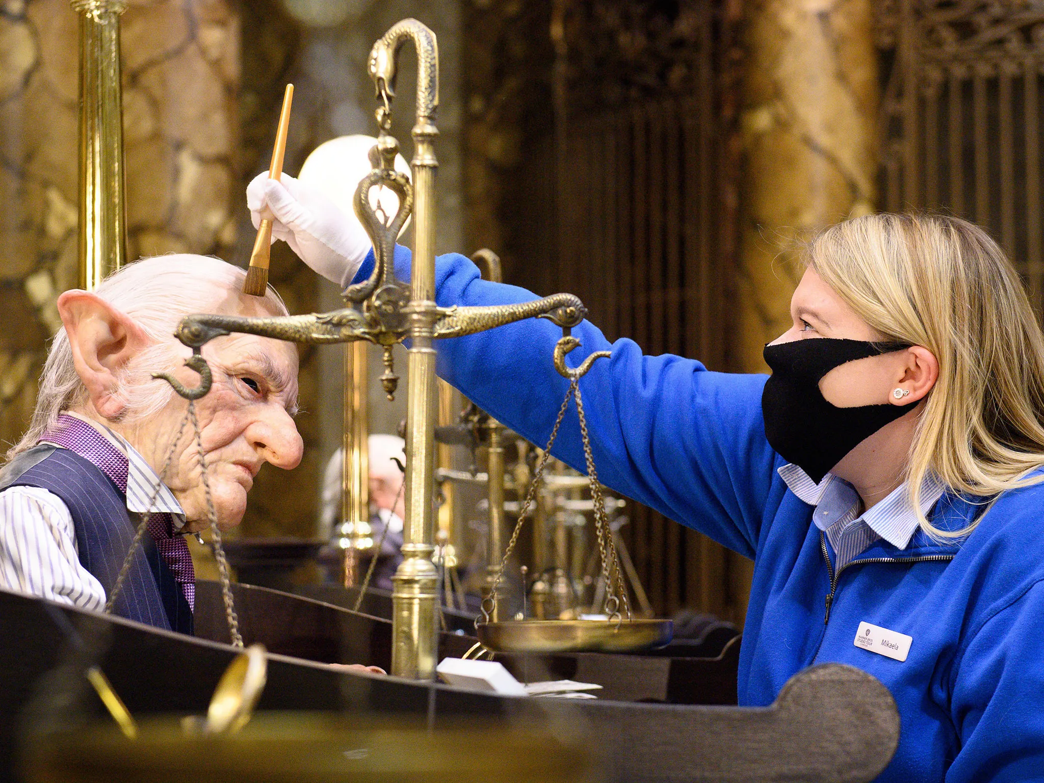 Original props in Gringotts Wizarding Bank are prepared by an Interactor ahead of Warner Bros. Studio Tour London reopening its doors to fans on [insert date] to experience the BTS magic.