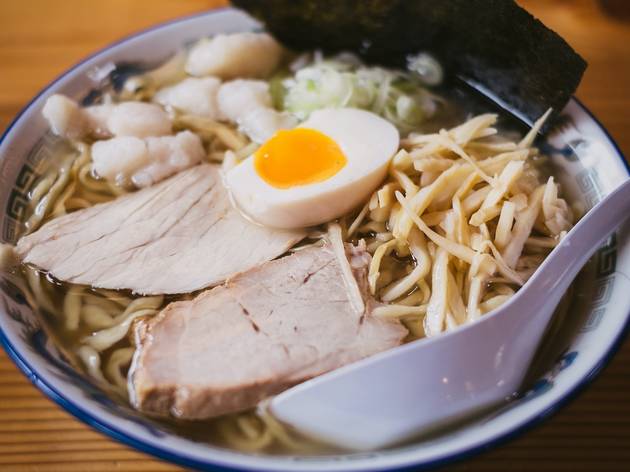 Generic ramen image A bowl of ramen in a blue and white china bowl. There is a white spoon in the bowl and the ramen is topped with two thick slices of pork, half a soft boiled egg and a slice of dried seaweed