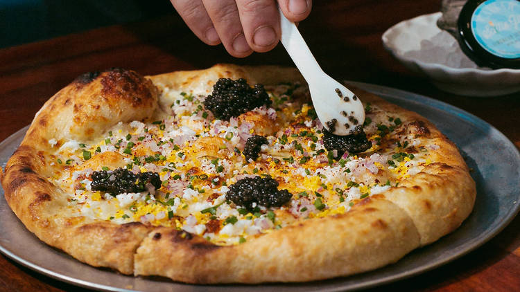 Saltie Girl Seafood Pizza's caviar pizza.