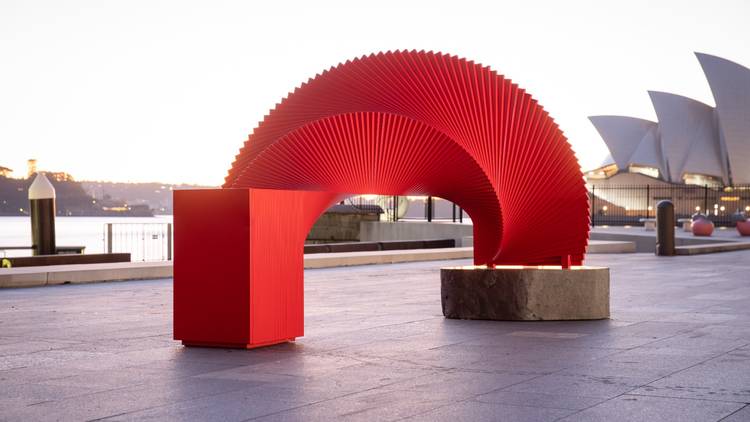 A red concertina-like sculpture with the Opera House as the backdrop