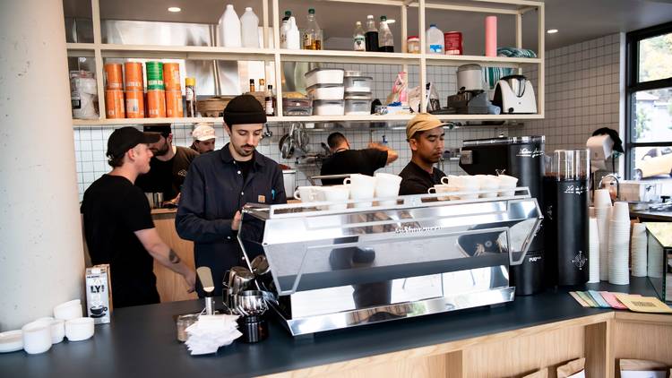 People behind coffee counter