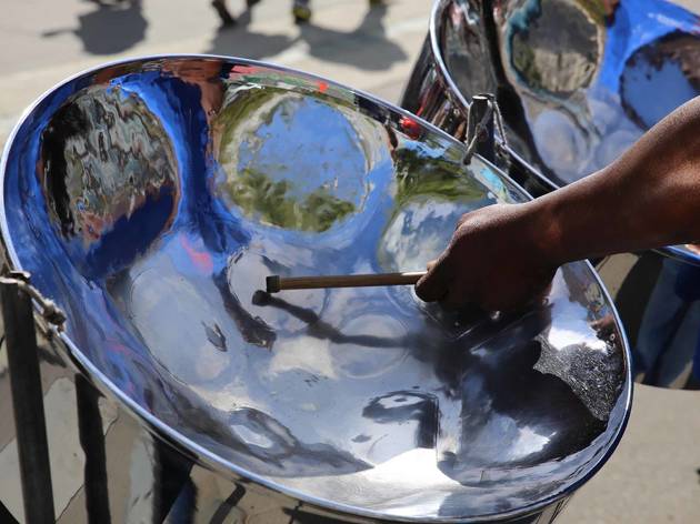 Steel,Pan,Drum,Player,With,Sticks Steel drum