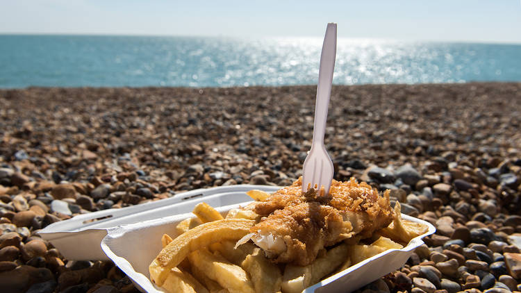 Eat fish and chips on the pebbles in Brighton