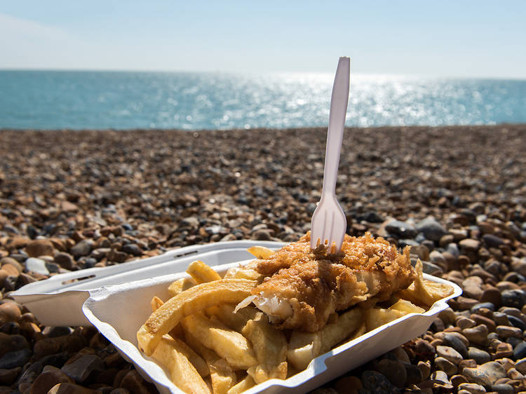 Eat fish and chips on the pebbles in Brighton