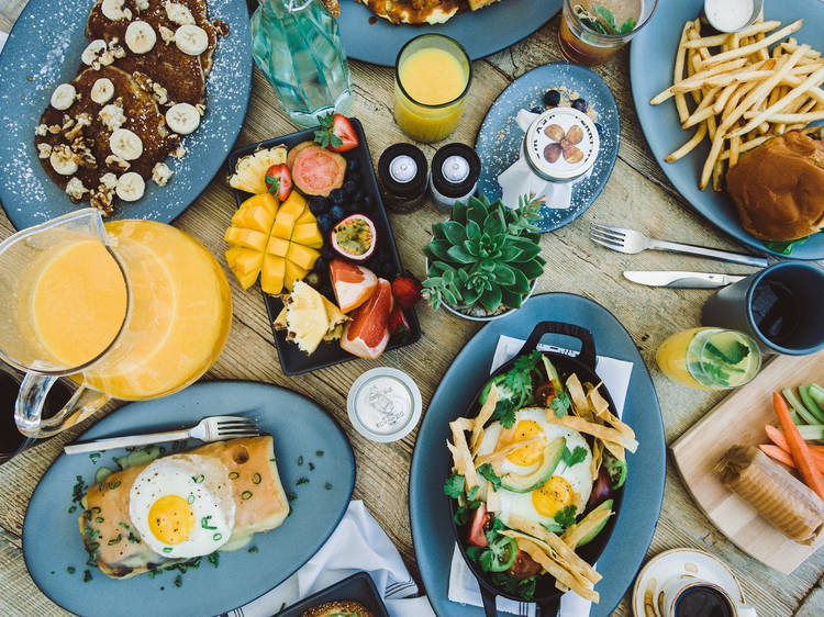 Table filled with plates of food for brunch