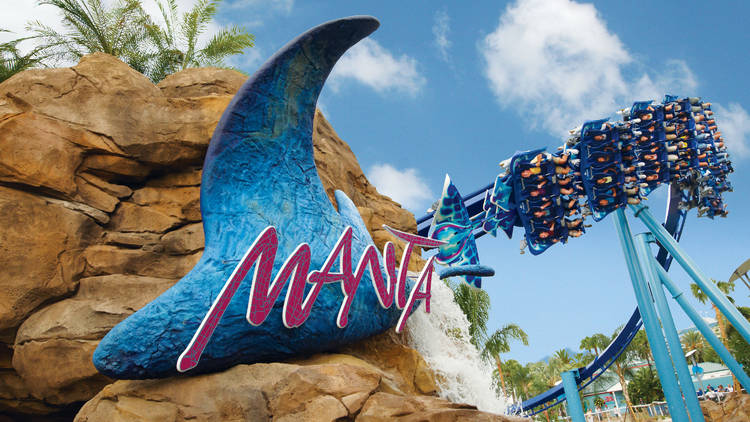 Sign that says Manta with a rollercoaster in the background