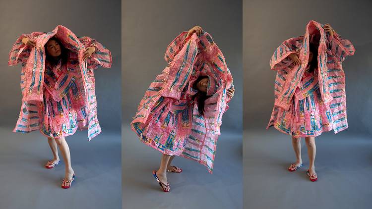 Artist Kiki Ando wearing pink-coloured clothing made from paper 