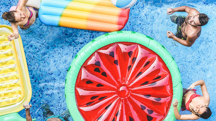 People in a pool, summer, floaties