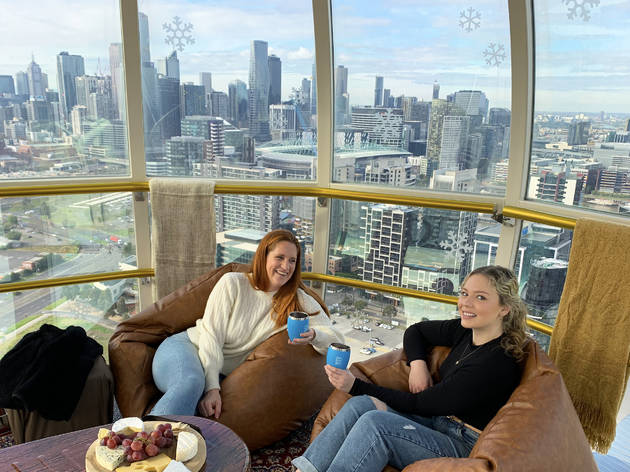 Melbourne Star Winter Chalet 2021 Two people on beanbags on Melbourne Star