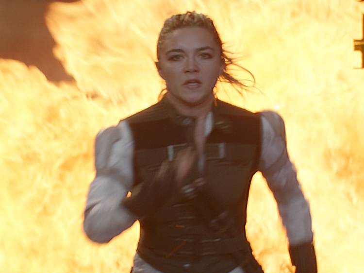 Florence Pugh as Yelena Belova, running from an explosion