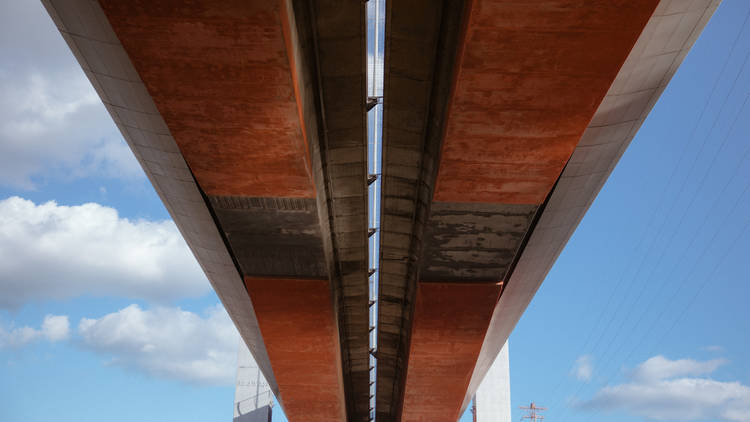 the underside of the Bolte Bridge.It is a blue sky day.