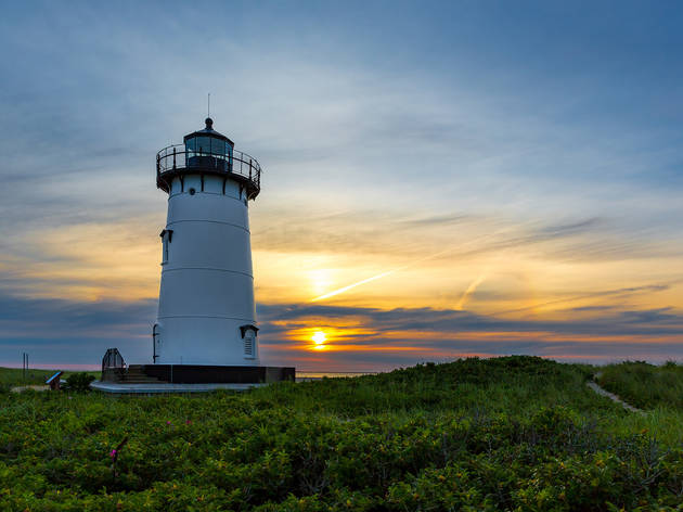 Edgartown Lighthouse, Martha's Vineyard Sun rising over the circular white building of Edgartown Lighthouse, Martha's Vineyard