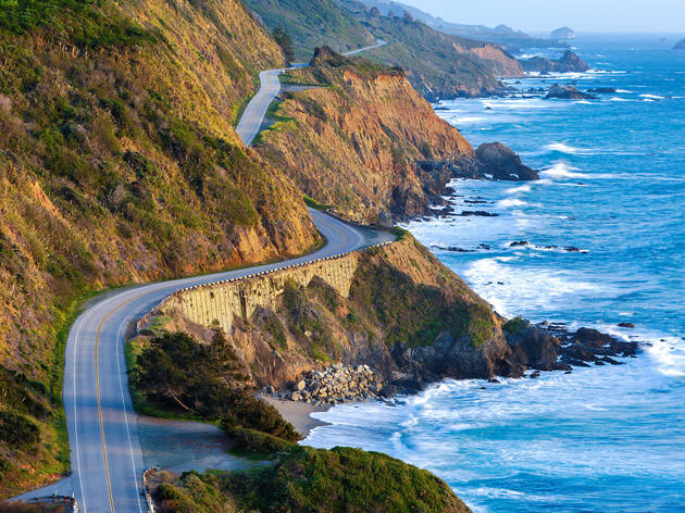 The Pacific Coast Highway at the southern end of Big Sur Winding road along the edge of cliffs justting out into the sea on the Pacific Coast Highway