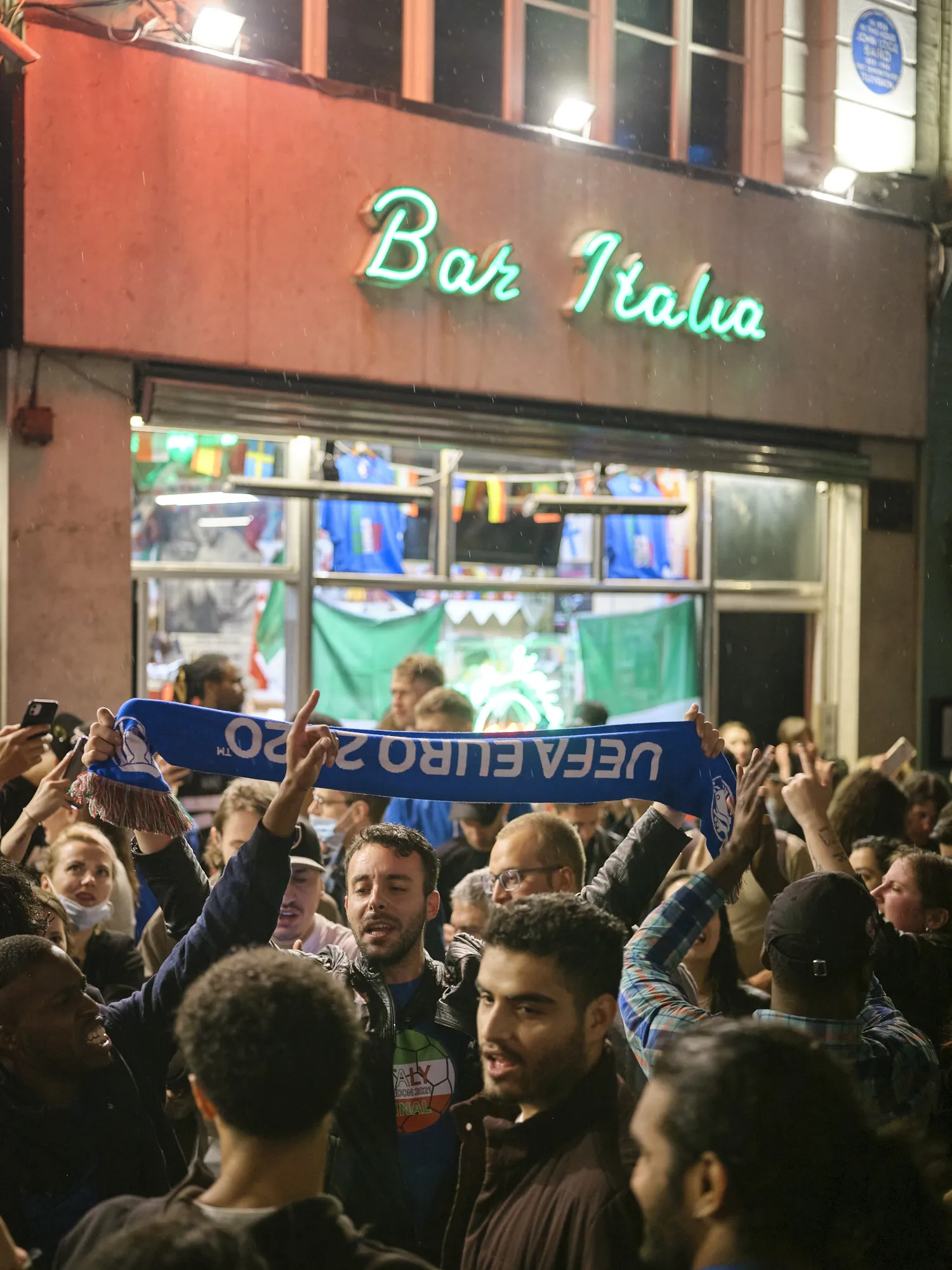Italian fans celebrate at Bar Italia