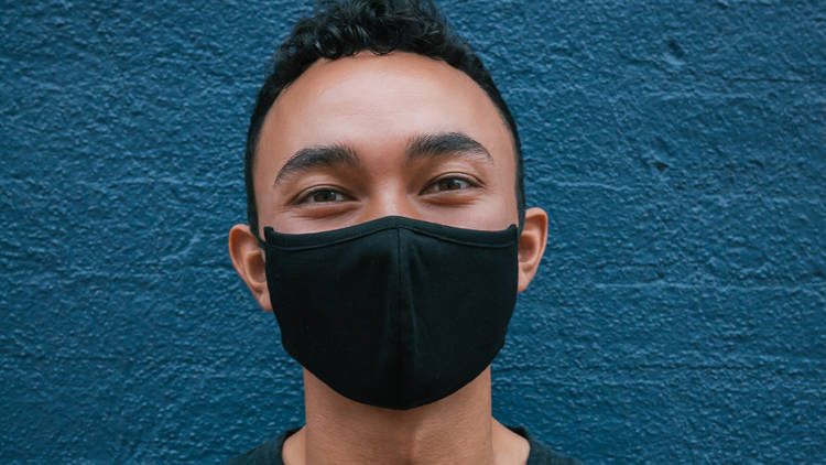 Man wearing mask smiling