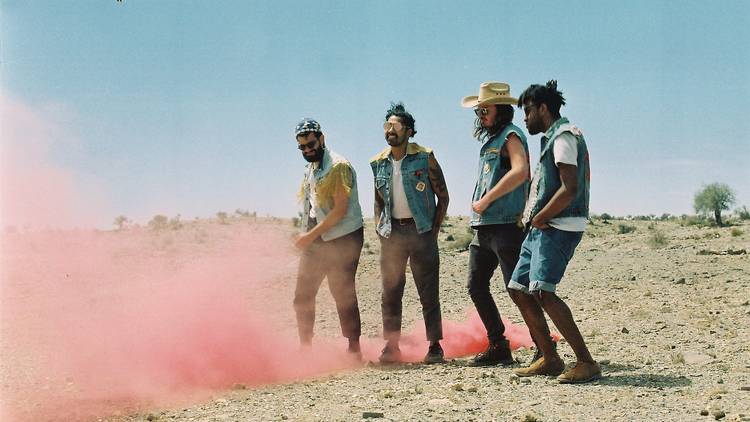 Band in a field with a flare