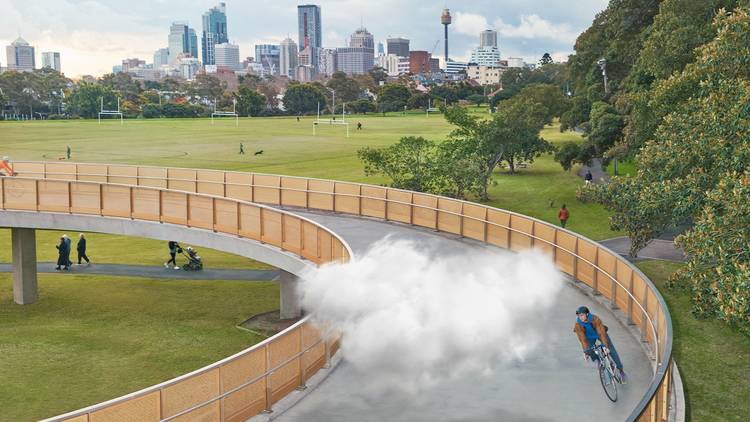 A cloud over a bike path with the Sydney skyline in the distance