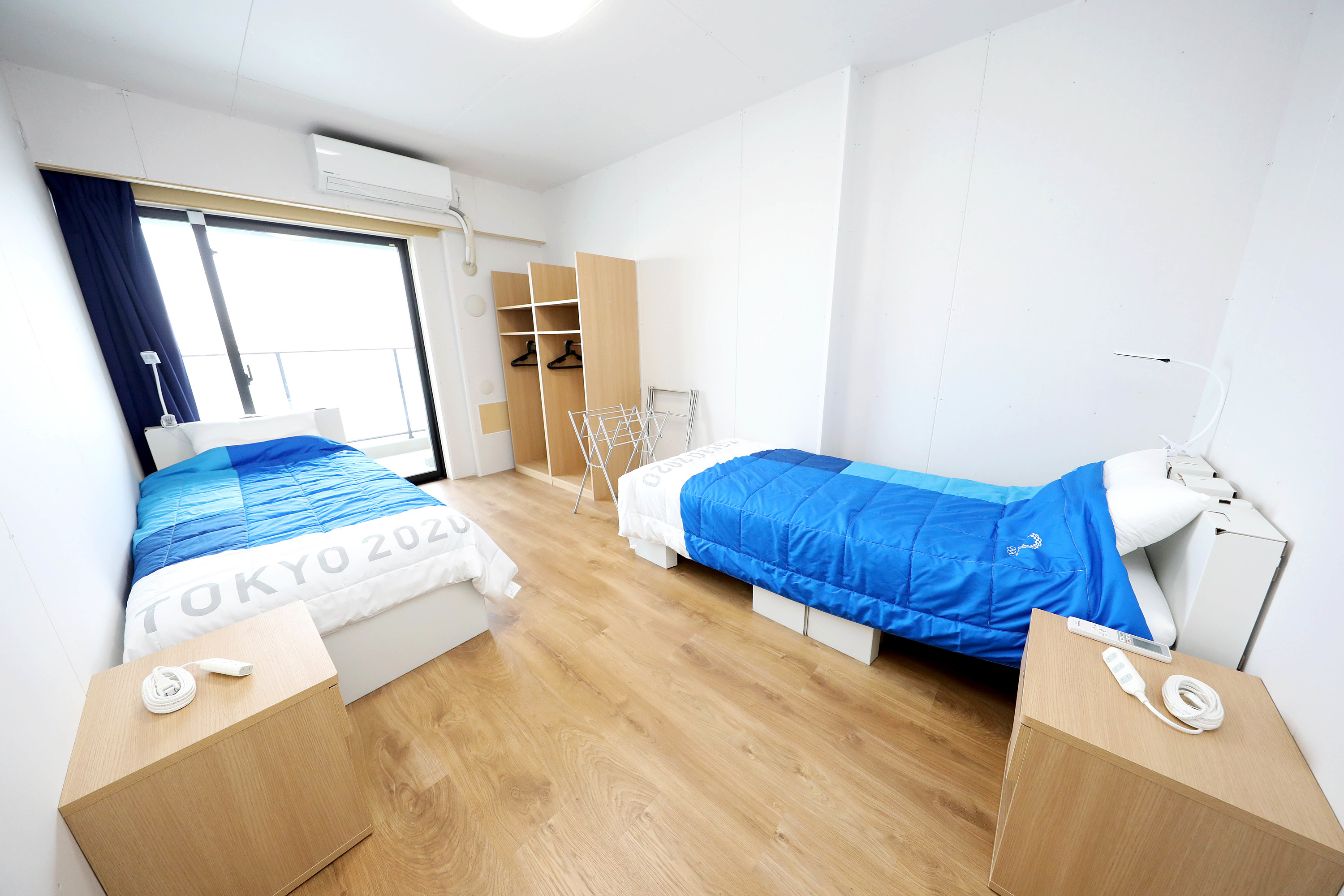 Watch athletes test out the famous cardboard beds at the Olympic Village